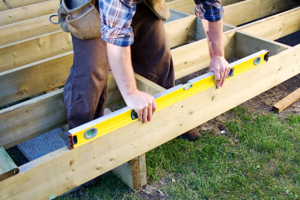 Builder building floating deck