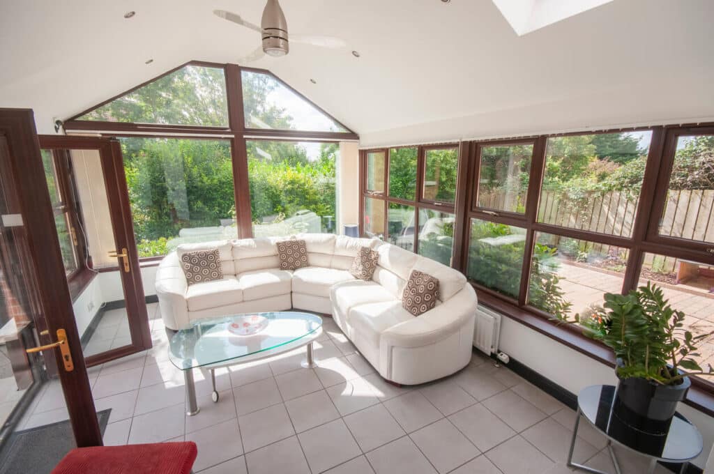 White leather sofa in a modern sun room